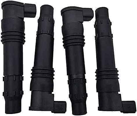 Set of four black automotive ignition coils arranged in a row on a white background