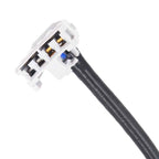 Close-up of white automotive electrical connector with black wire for oxygen sensors or ignition coils