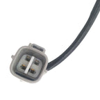 Close-up of OEM automotive electrical connector with four metal pins and attached black cable