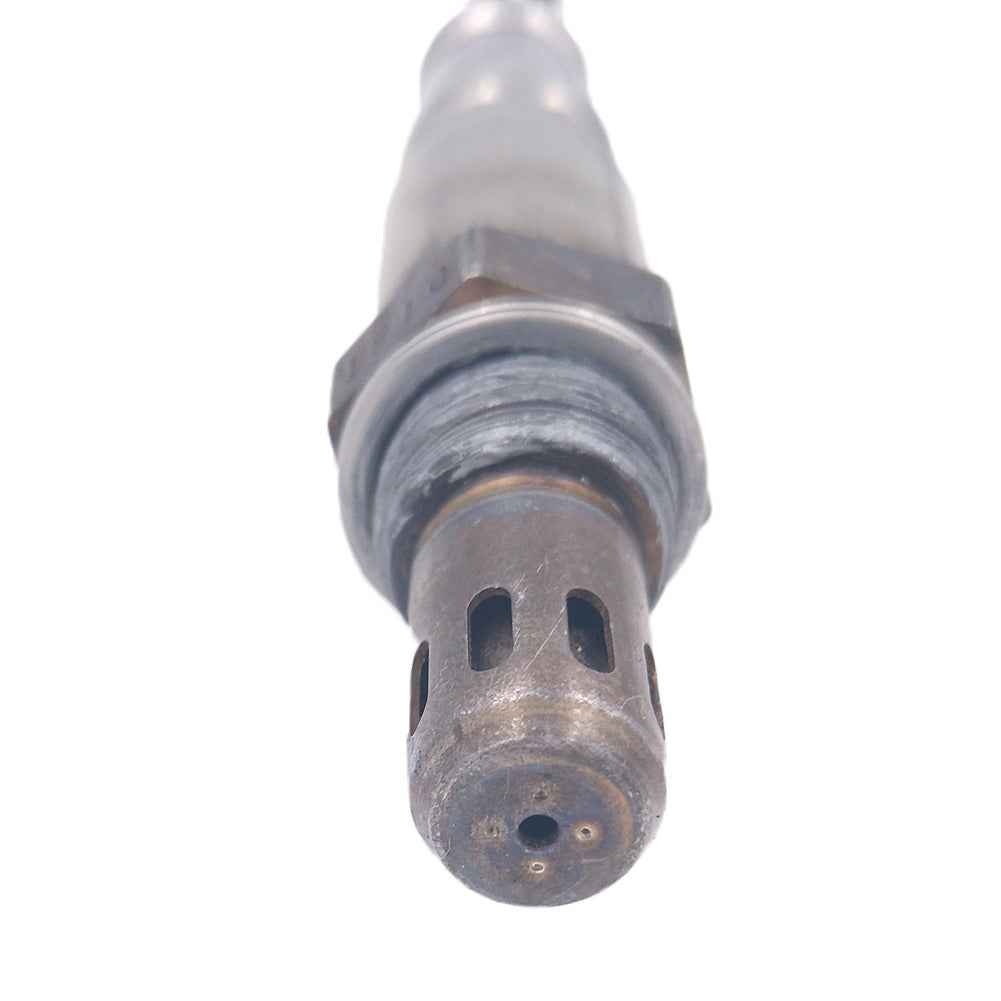 Close-up of an automotive oxygen sensor with metal casing and sensor tip for vehicle emissions control