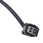 Close-up of black automotive wiring harness connector with four-pin socket on white background