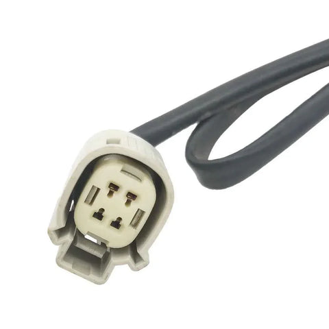Close-up of a gray automotive electrical connector with three pins and attached black wire