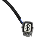 Close-up of a 4-pin automotive electrical connector with black and blue wires, OEM quality part