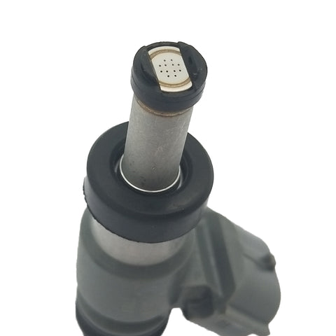 Close-up of automotive fuel injector with metal body and black rubber seals on white background