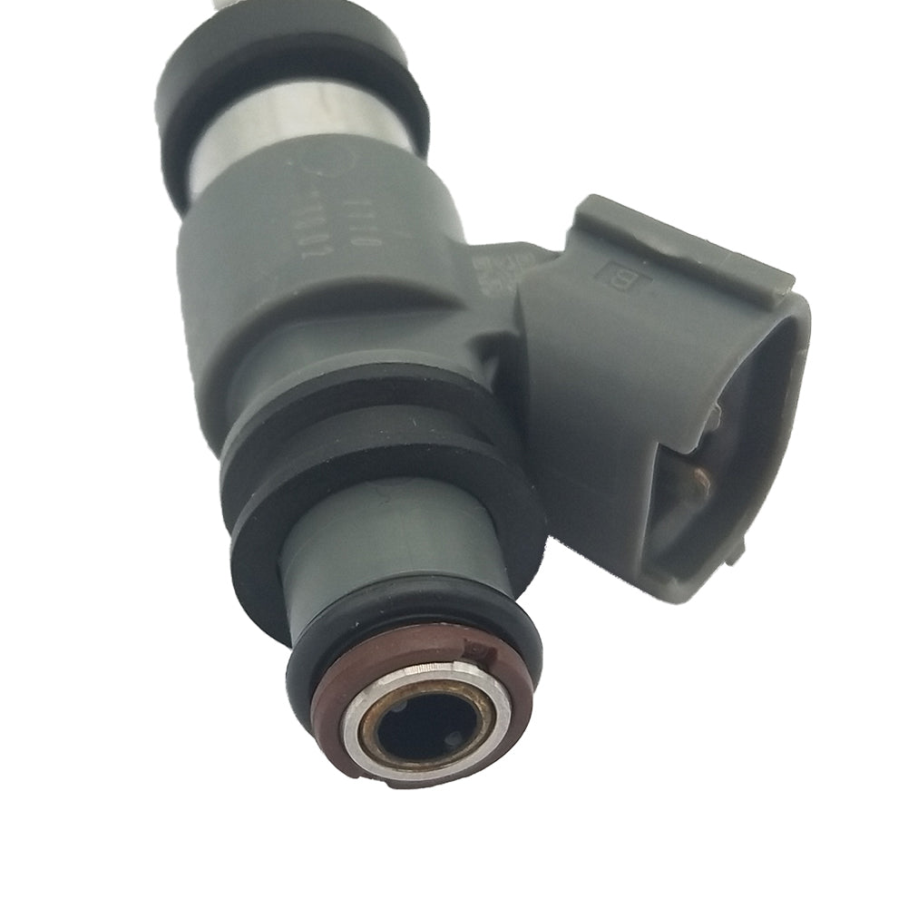 Close-up of a gray automotive fuel injector with rubber seals and electrical connector