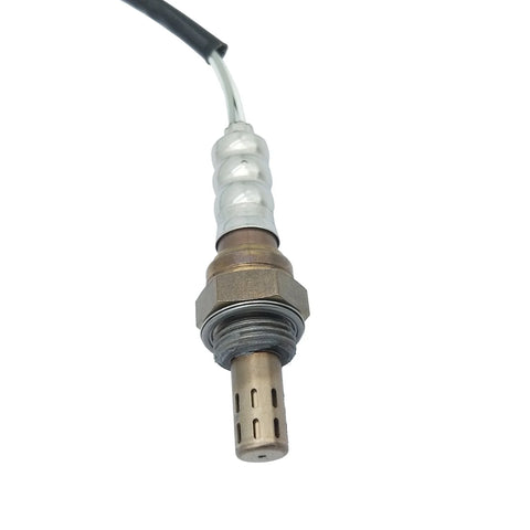 Close-up of automotive oxygen sensor with metal body, threaded hex nut, and black wire