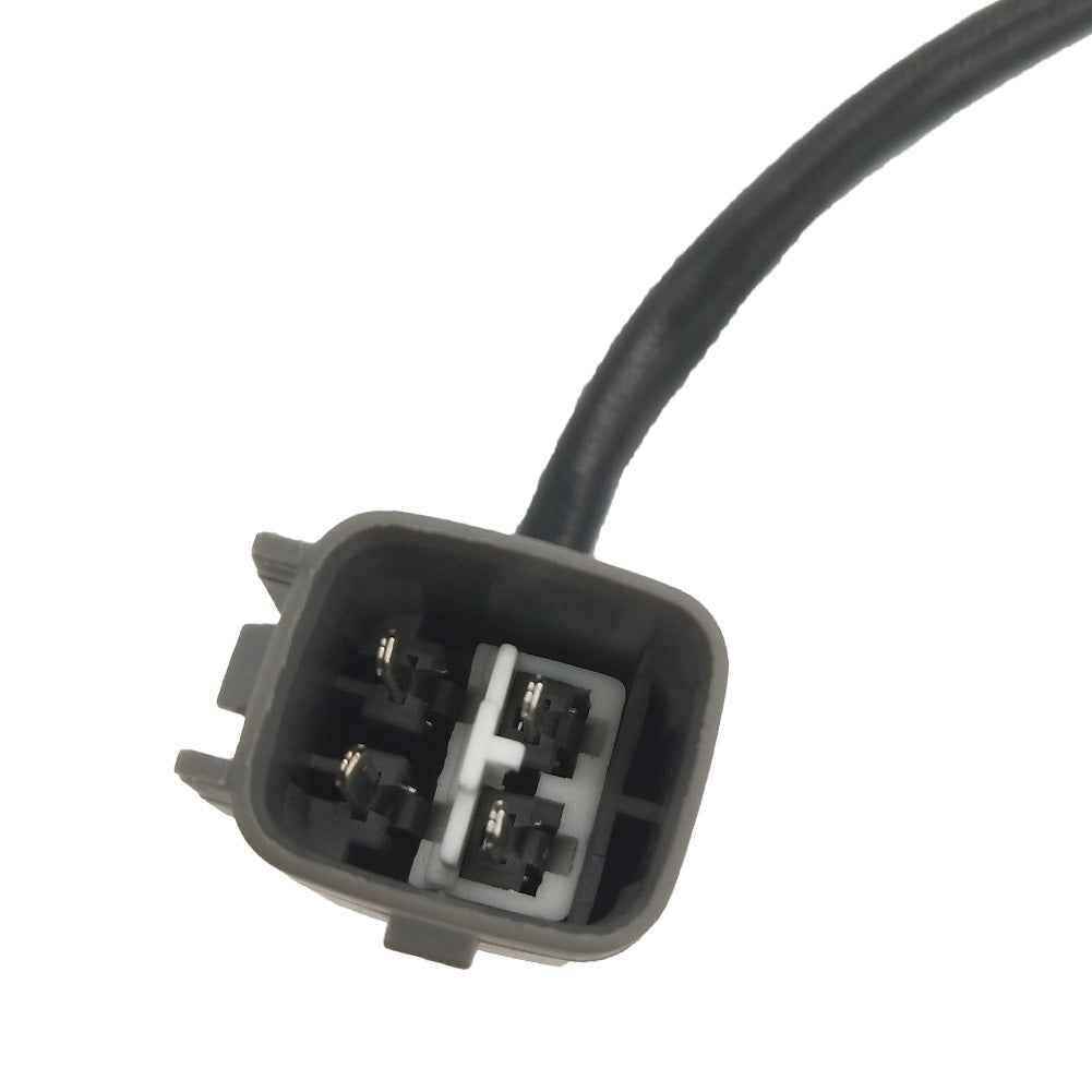 Close-up of a black automotive electrical connector with four metal pins and attached cable
