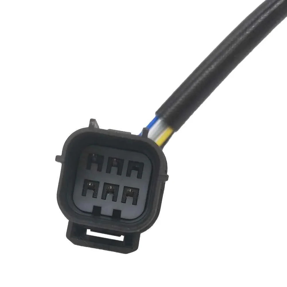 Close-up of a 6-pin automotive electrical connector plug with attached wires for vehicle sensor or ignition system