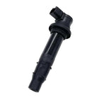Black automotive ignition coil for vehicle engine ignition system on white background