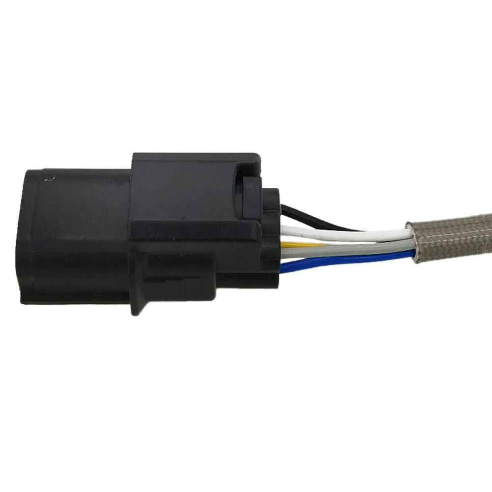 Close-up of black automotive electrical connector with black, white, yellow, and blue wires wrapped in protective sleeve