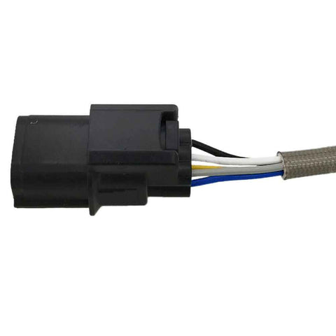 Close-up of black automotive electrical connector with black, white, yellow, and blue wires wrapped in protective sleeve
