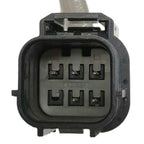 Close-up of black 6-pin automotive electrical connector for oxygen sensor or fuel injector