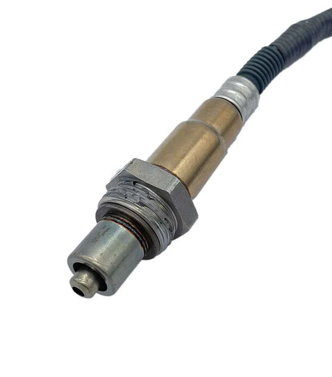 Close-up of a vehicle oxygen sensor with metal threads and wire connector on white background