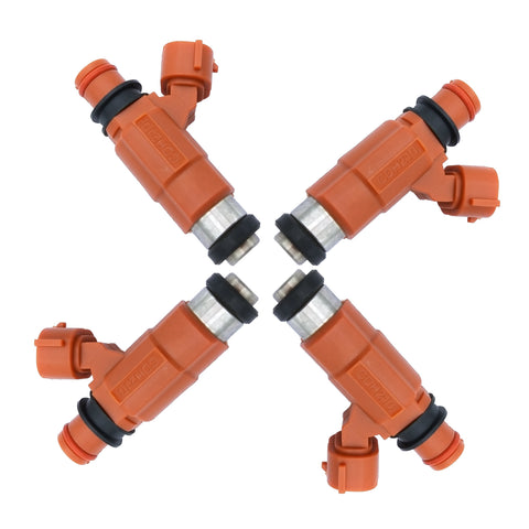 Set of four orange automotive fuel injectors with black seals isolated on white background