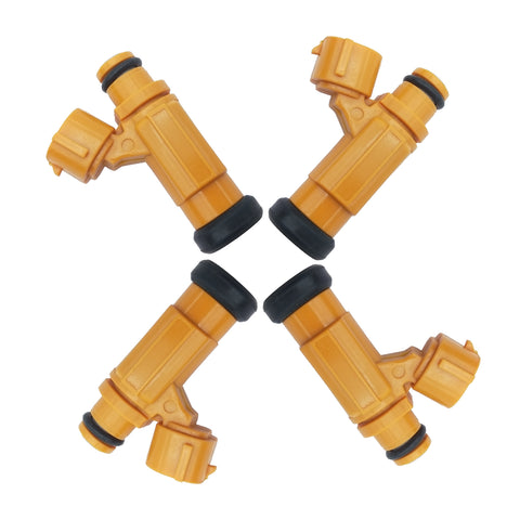 Set of four yellow vehicle fuel injectors with black seals isolated on white