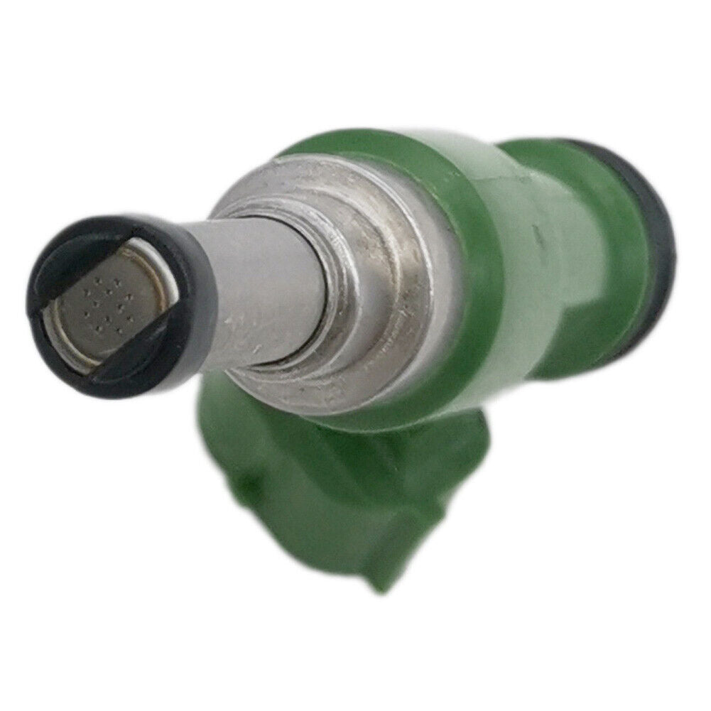 Green automotive fuel injector with metallic nozzle and black rubber seals on white background